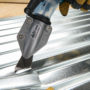Malco's TSCM cutting between the ridges of a silver corrugated metal roof