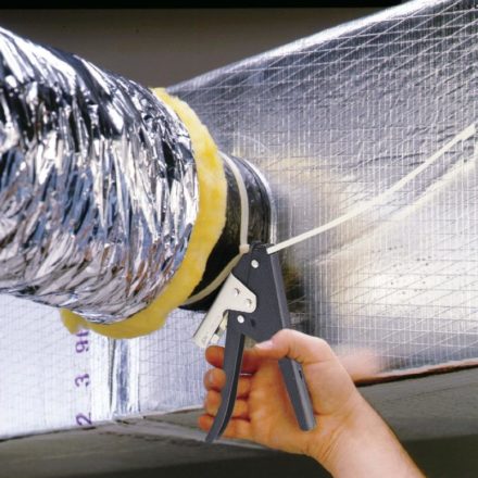 Man using Malco's TY4 to secure a nylon tie to fiberglass duct