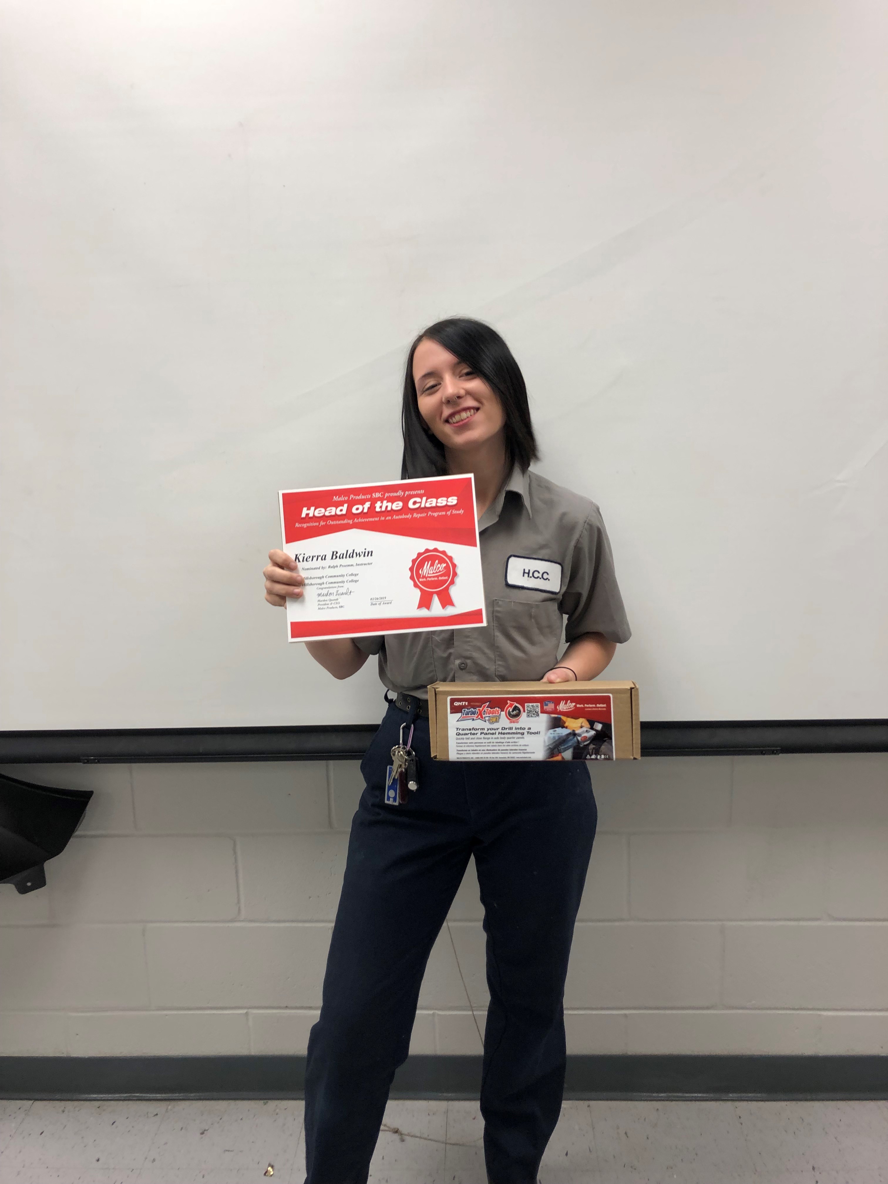 Kierra Baldwin holding head of class certificate