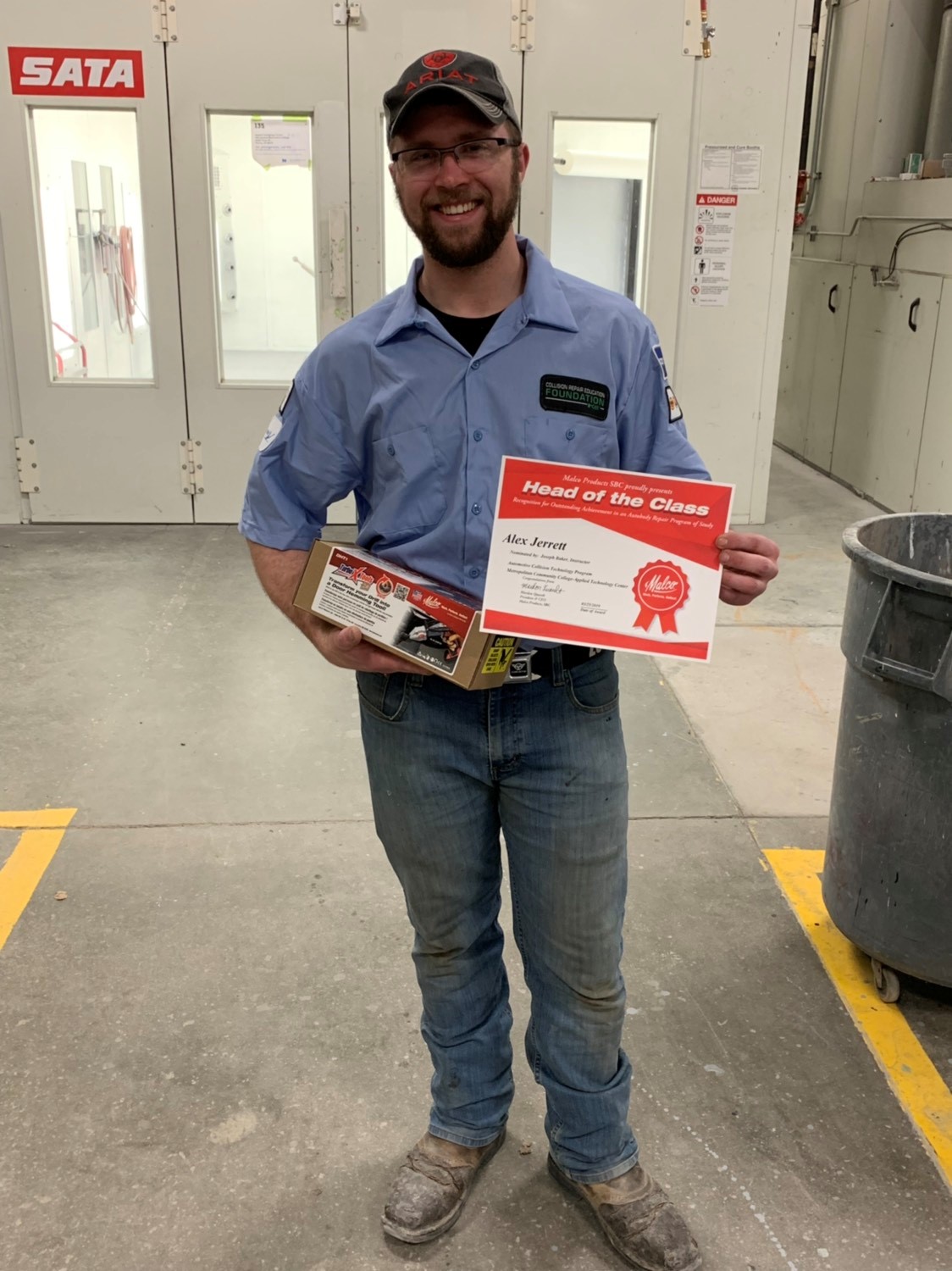 Student holding head of class certificate | Malco Tools