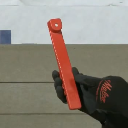 Man holding a Malco Fiber Cement Facing Gauge