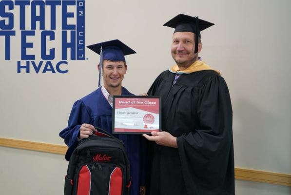 Student and teacher holding the Head of the Class Program certificate 