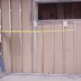 Man using measuring tap to show how well the magnetic tape measures works